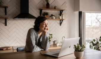 woman smiling while on virtual relationship coaching session
